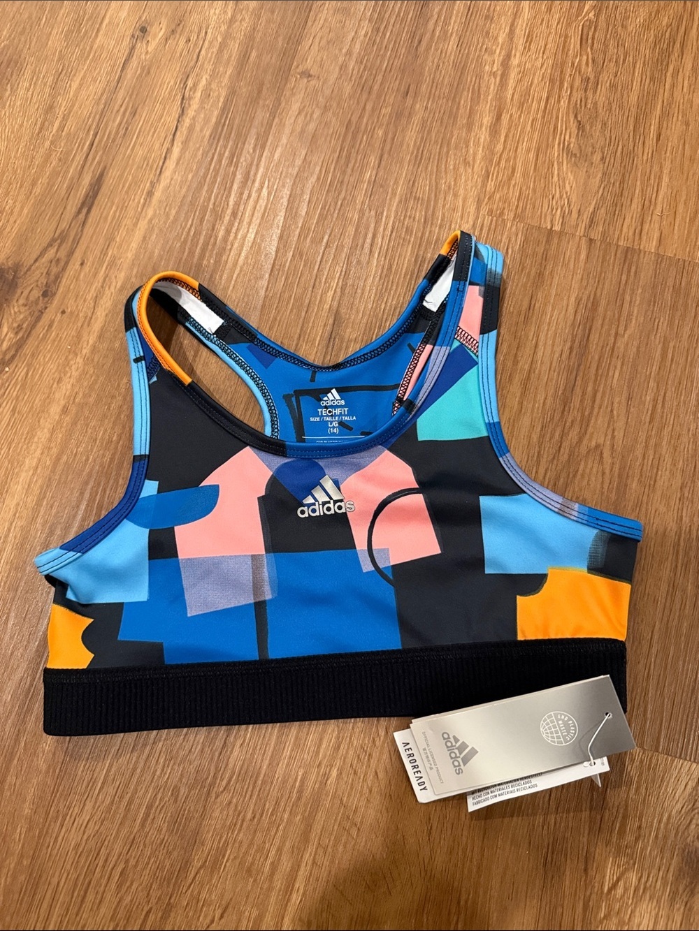adidas Colorblock Racerback Sports Bra in Blue, Black, Orange, Pink